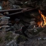 Emergency underground Bunker building with stones and wood.Hardwork.Special fireplace kamin