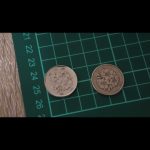 １００円玉磨き　ピカピカに磨きました。桜が綺麗に映えています。