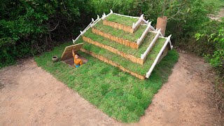 Building secret underground house with grass roof and clay